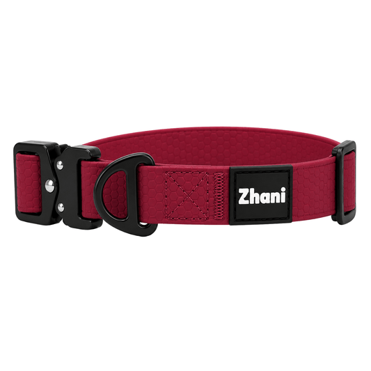 A red dog collar with black metal hardware, featuring a black brand patch that reads 'Zhani' in white text, shown against a plain white background.