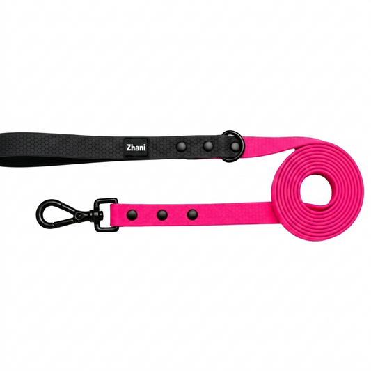 Black and pink dog leashes with clip on a white background