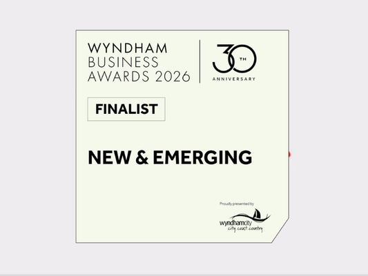 Logo for 'Wyndham Business Awards' with a stylized dog icon on a light grey background.